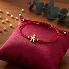 Гривна с червен конец и 14 карата златна фигура момче Гривна с червен конец и 14 карата златна фигура момче