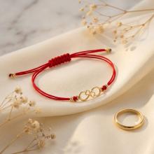 Гривна с червен конец и 14 карата златен елемент безкрайност Гривна с червен конец и 14 карата златен елемент безкрайност