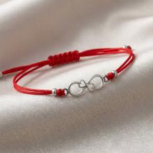 Гривна с червен конец и сребърен елемент безкрайност Гривна с червен конец и сребърен елемент безкрайност