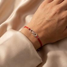 Гривна с червен конец и сребърен елемент безкрайност Гривна с червен конец и сребърен елемент безкрайност