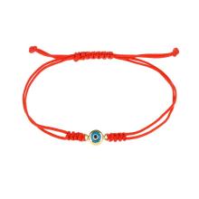 Гривна с червен конец и златен елемент синьо око