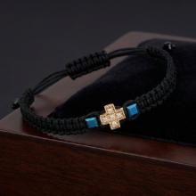 Гривна с червен конец и 14 карата златен елемент кръст с циркони Гривна с червен конец и 14 карата златен елемент кръст с циркони