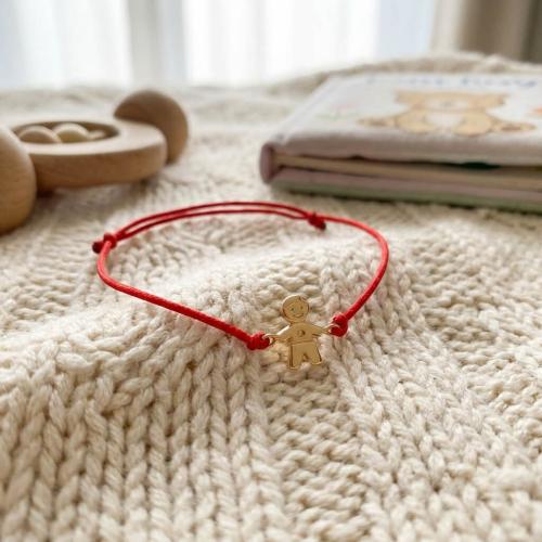 Гривна с червен конец и 14 карата златен елемент момче