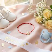 Гривна с червен конец и 14 карата златен елемент момче Гривна с червен конец и 14 карата златен елемент момче