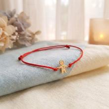 Гривна с червен конец и 14 карата златен елемент момче Гривна с червен конец и 14 карата златен елемент момче