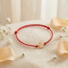 Гривна с червен конец и 14 карата златен елемент момче Гривна с червен конец и 14 карата златен елемент момче