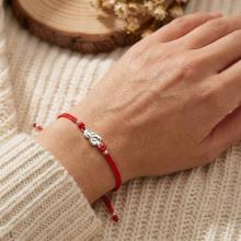 Гривна с червен конец и сребърен елемент Богородица