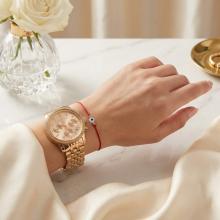 Гривна с червен конец златни топчета и синьо око