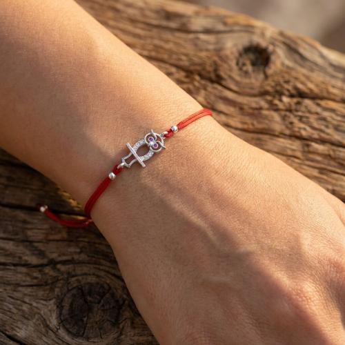 Гривна с червен конец и сребърен елемент сова