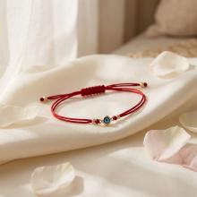 Гривна с червен конец и златен елемент синьо око BT41 Гривна с червен конец и златен елемент синьо око BT41