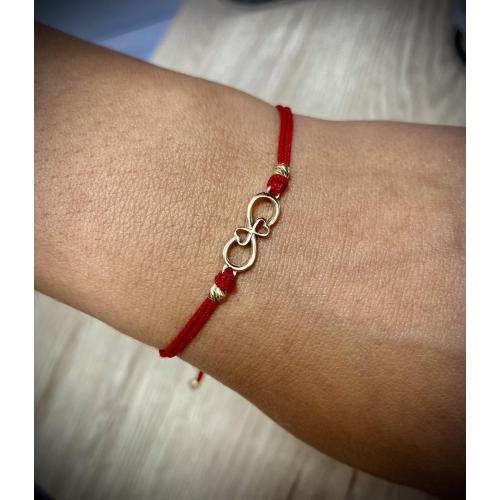 Гривна с червен конец и 14 карата златен елемент безкрайност