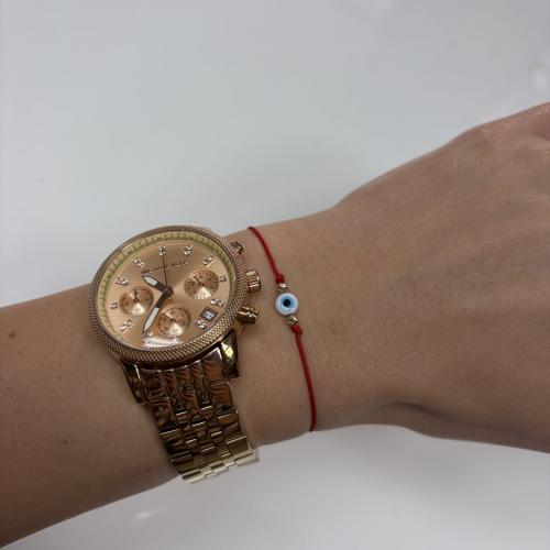 Гривна с червен конец златни топчета и синьо око